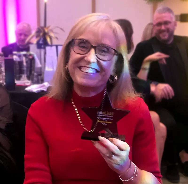 Margaret Reeves holding the Executive Leader of the Year – Bronze Award at the miaList Awards